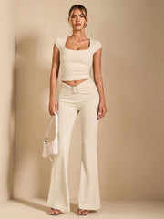 DEEP NECK CROP TOP AND SQUARE EMBELLISHED PLEATED FLARE PANTS