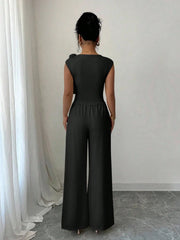 PEPLUM ROUND NECK TOP ASYMMETRICAL HEM AND LONG PANTS